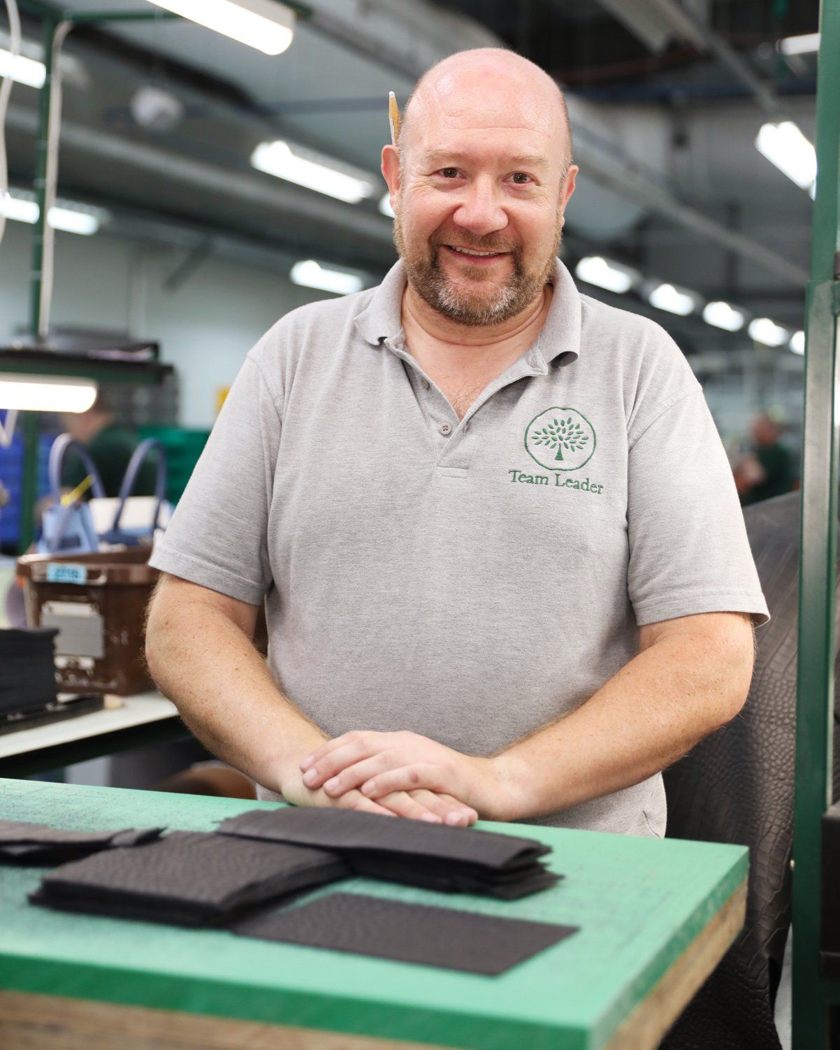 Mulberry employee at the cutting station in the factory